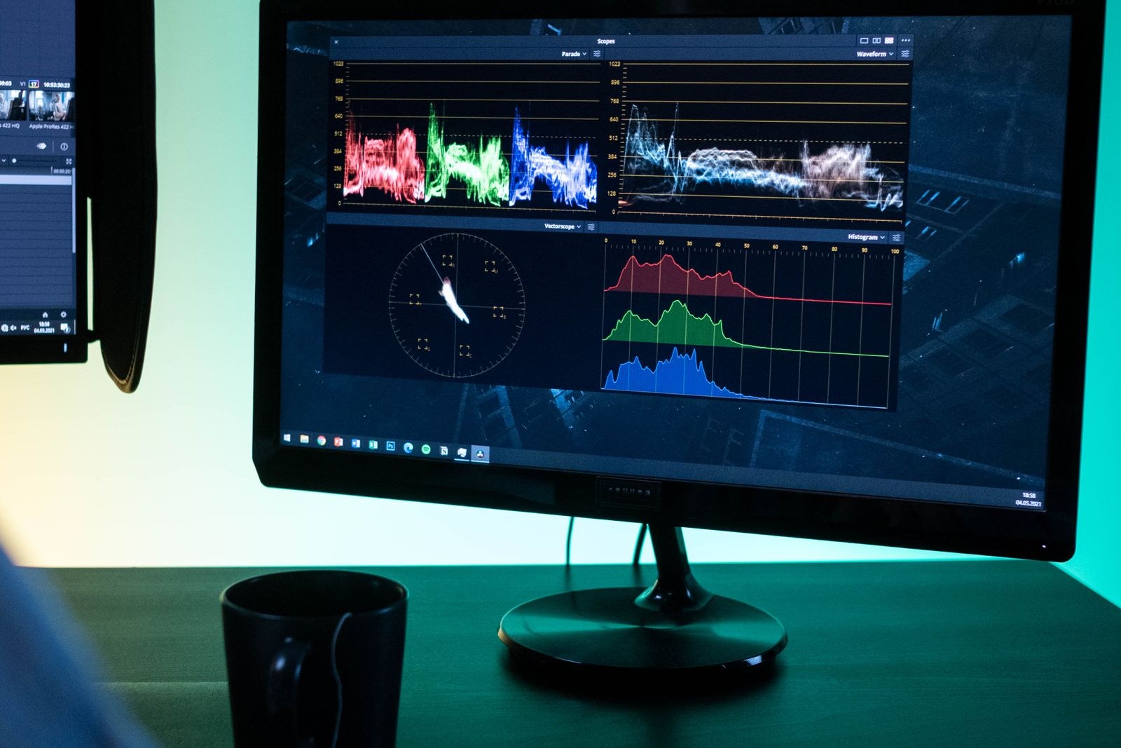 Editor at a workstation reviewing a timeline